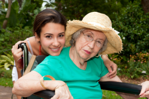 caregiver and senior smiling