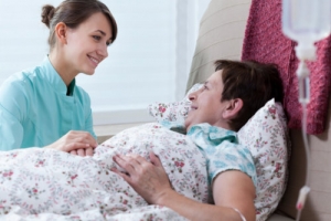 caregiver and senior smiling