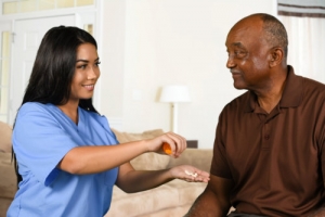 senior and caregiver smiling